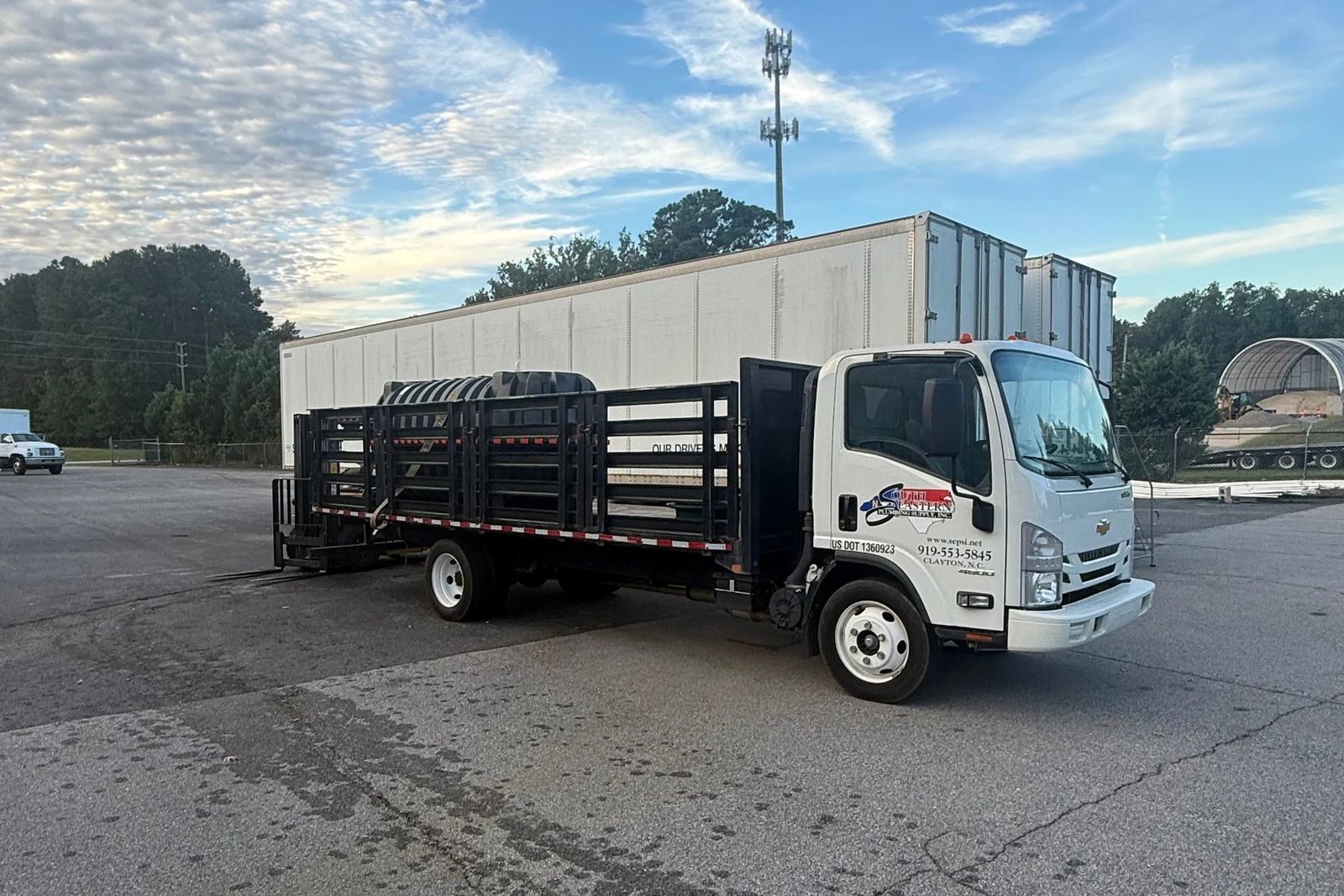 A South Eastern flatbed delivery truck in the lot