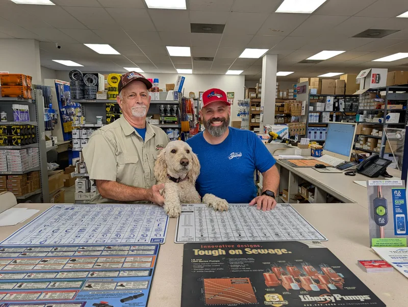 Ricky and Travis at the counter with Bentley between them